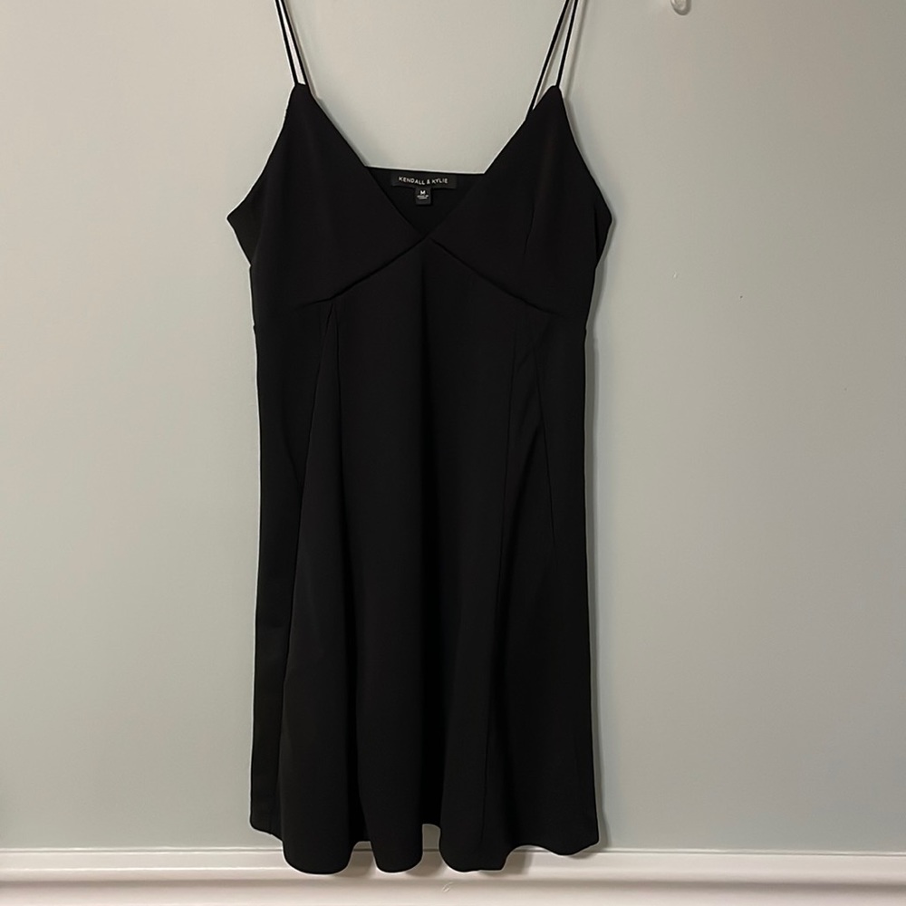 Little a-line black dress. Kendall and Kylie brand. Low cut. Size medium